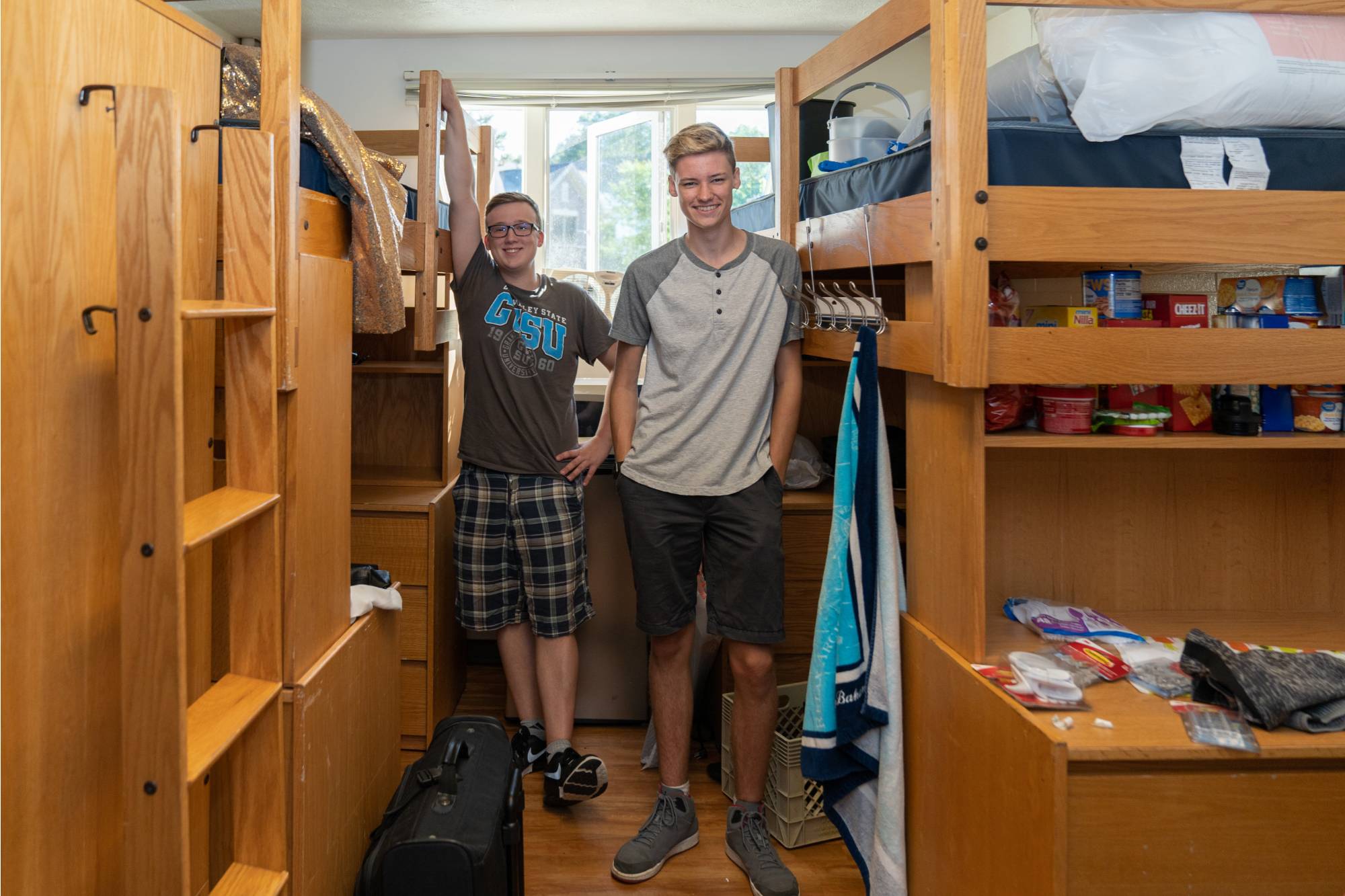 Two roommates on move-in day.
